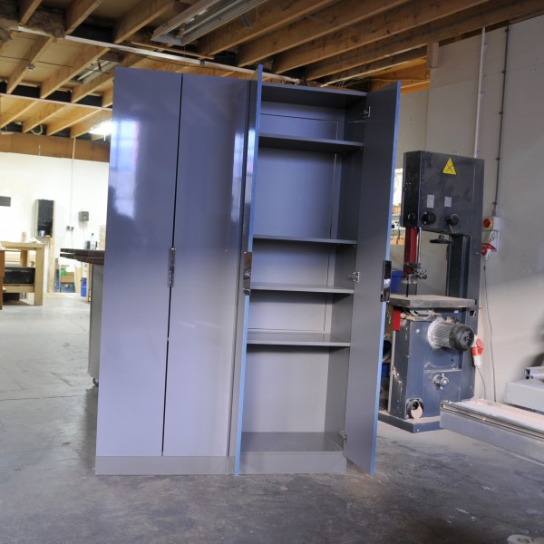 wardrobe in high gloss grey acrylic with clever hinged access panel behind shelves